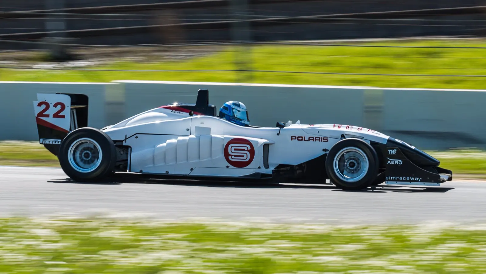 Jeff Kirk driving Formula 3 car number 22 at speed on the race circuit